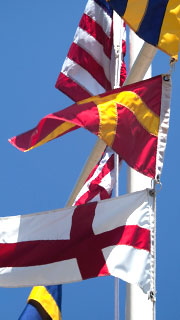 Flags waving in the sunlight at Putt Cove